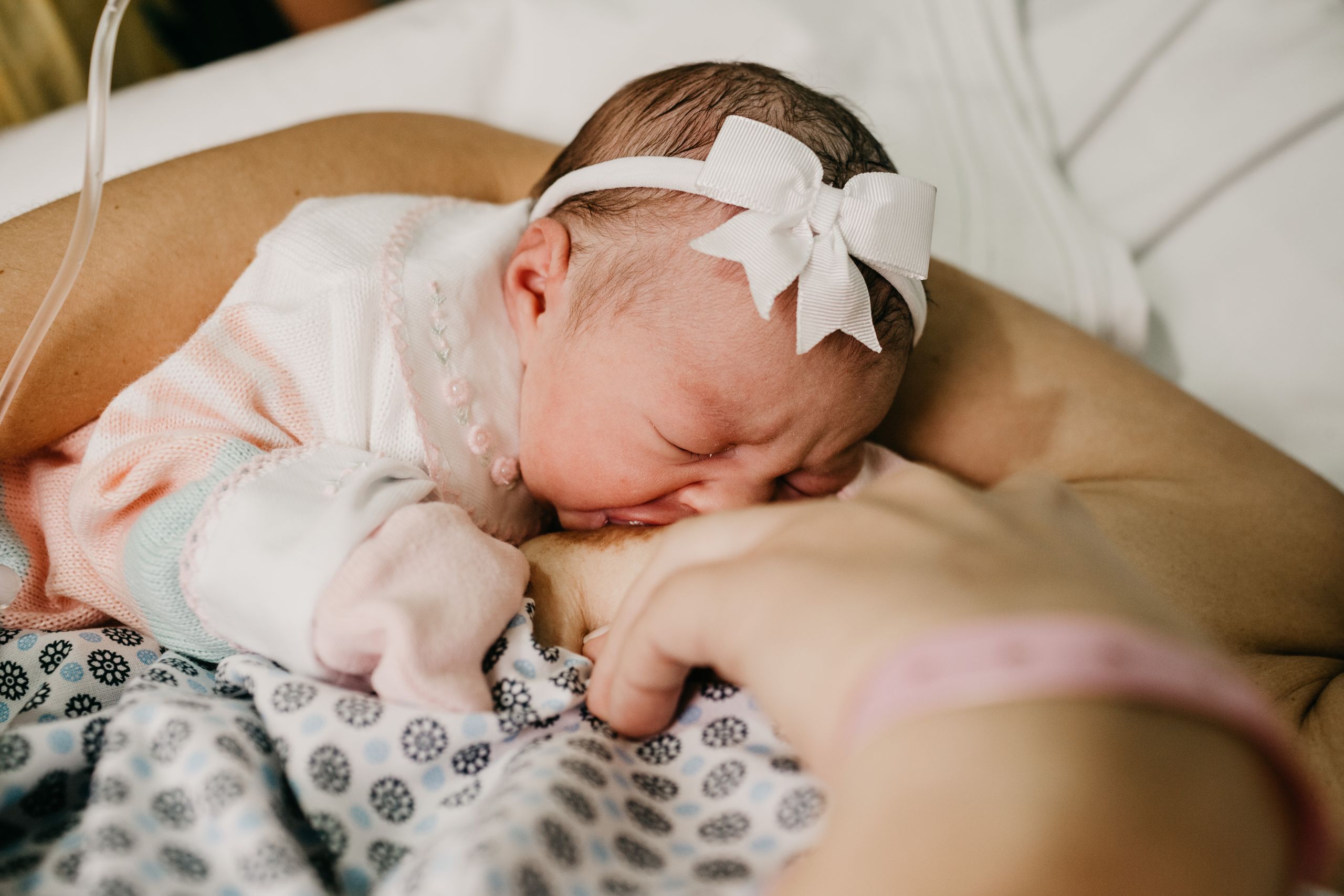 Newborn baby breastfeeding, representing breastfeeding basics for beginners